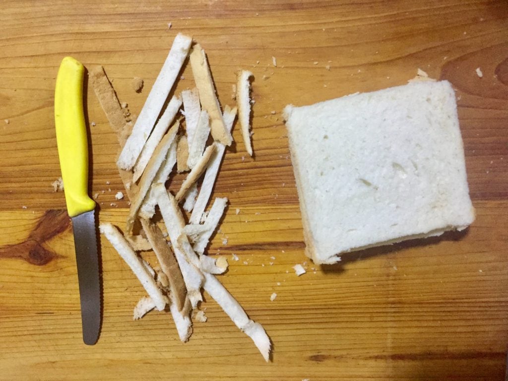 Trim sides of bread.